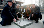 Picture: Guests of honor seal of the time capsule in the foundation with three taps of the hammer